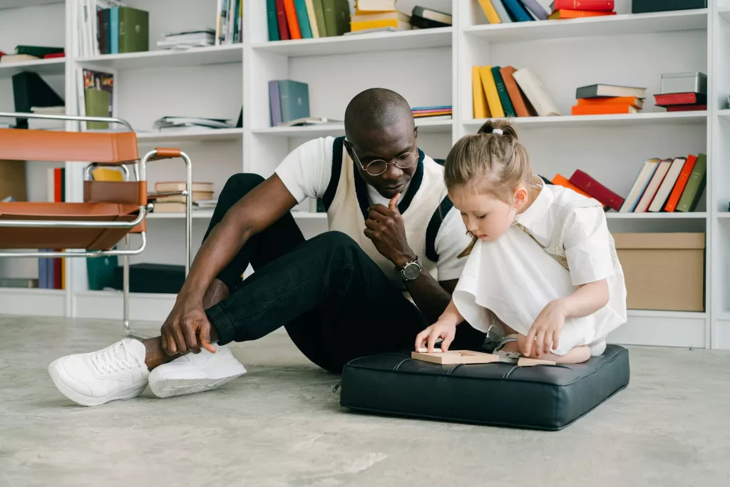 Man and child completing puzzle